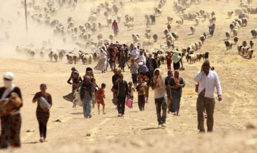 Habitantes da Síria e Iraque fugindo dos ataques do Estado Islâmico