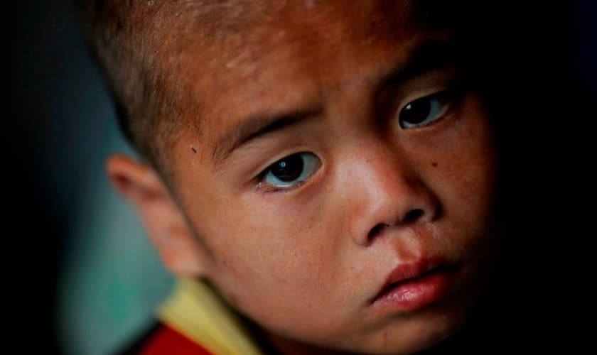 Criança norte-coreana em orfanato atingido por enchentes e tufões em Hwanghae Sul, em 2011. (Foto: Damir Sagolj/Reuters)