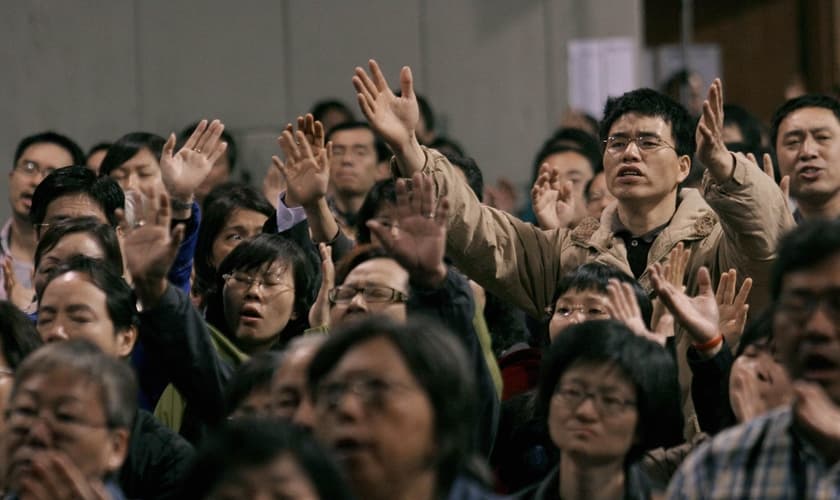 Cristãos participam de culto, na China. (Foto: Time)