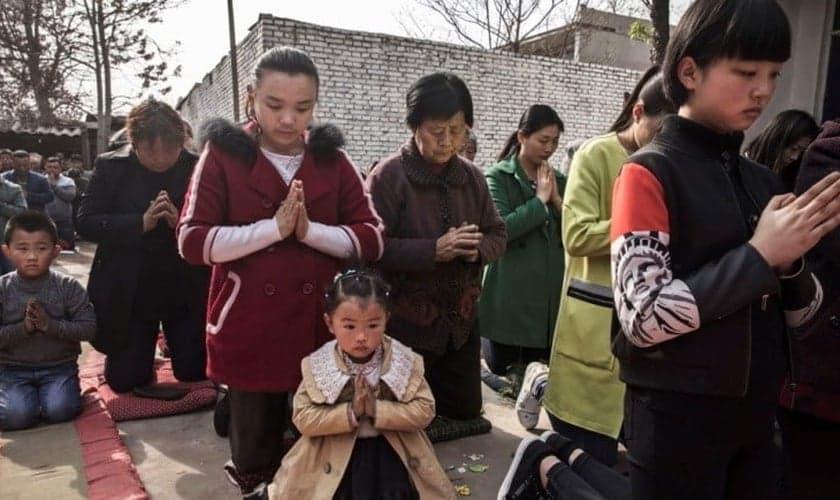 Cristãos participam de cerimônia na China. (Foto: Getty Images/Kevin Frayer)